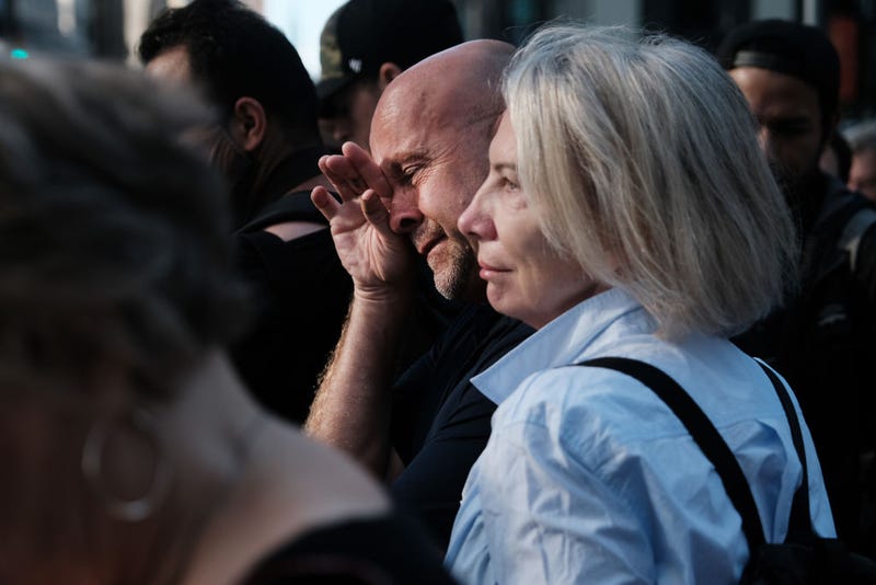 People gather in lower Manhattan near Ground Zero as the city commemorates the 20th anniversary of the September 11th terrorist attacks on the World Trade Center on September 11, 2021 in New York City. 