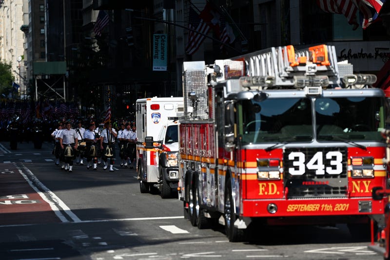 The 343 firetruck along with the FDNY Pipes and Drums and members of the New York City Fire Department participate in the processional as part the FDNY Memorial Service at St. Patrick's Cathedral on September 11, 2021 in New York City.