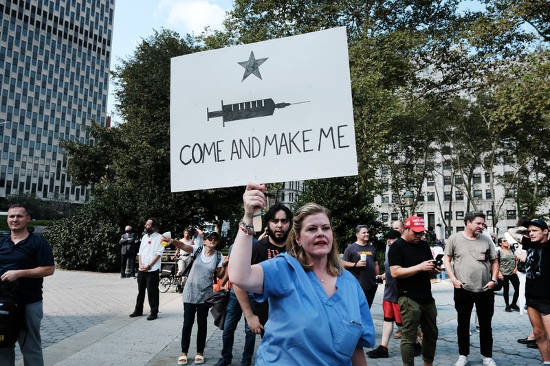 People participate in a rally and march against COVID-19 mandates on September 13, 2021 in New York City