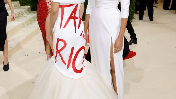 VIDEOS & PICS: AOC attends her first-ever Met Gala in 'Tax the Rich' gown