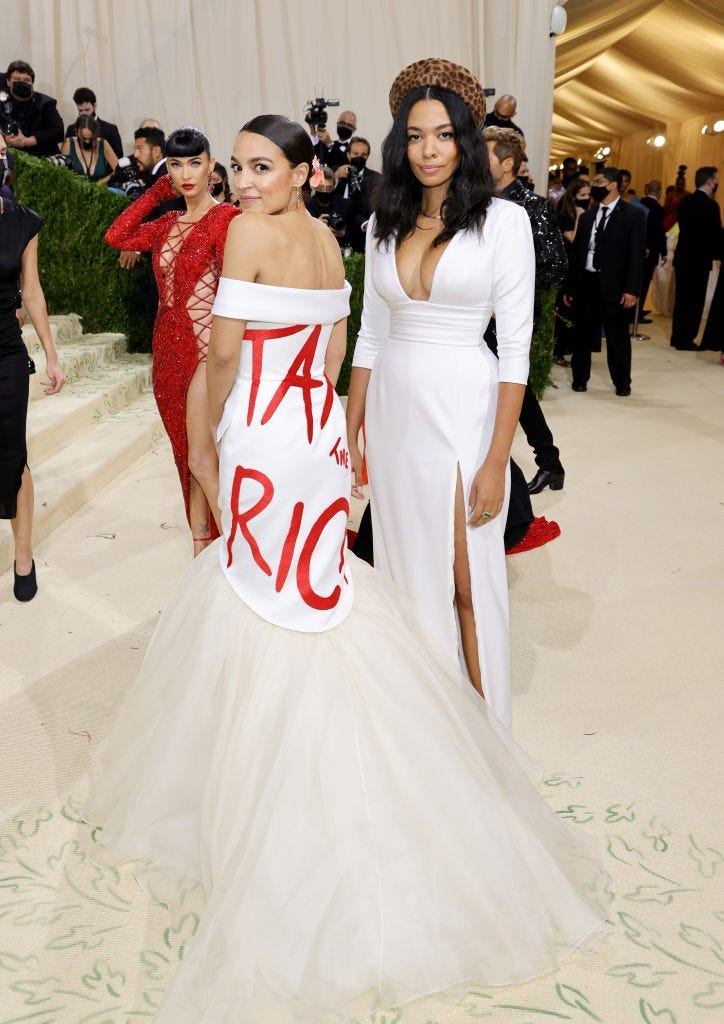 Alexandria Ocasio-Cortez and Aurora James attend The 2021 Met Gala Celebrating In America: A Lexicon Of Fashion at Metropolitan Museum of Art on September 13, 2021 in New York City.
