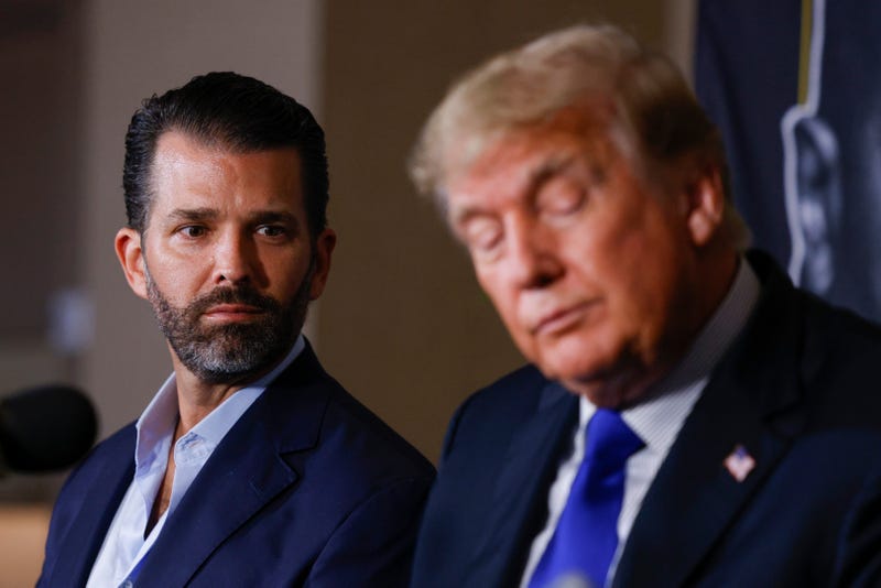 Donald Trump Jr. and former President of the United States Donald Trump look on prior to the fight between Evander Holyfield and Vitor Belfort during Evander Holyfield vs. Vitor Belfort presented by Triller at Seminole Hard Rock Hotel & Casino on September 11, 2021 in Hollywood, Florida