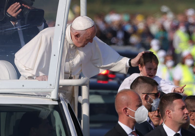 Pope Francis blesses a child while riding his Pope mobile through a crowd of pilgrims before holding an open-air mass on September 15, 2021 in Sastin, Slovakia. Today's mass concludes an apostolic trip by the Pope to Central Europe from September 12 to 15. The Pontiff visited five cities, starting with Budapest, Hungary, for the closing mass of the 52nd International Eucharistic Congress, continuing with the Slovak capital Bratislava, and visiting Kosice, Presov and Sastin. Only fully vaccinated and a limited number of tested worshippers have been allowed to attend public gatherings on this occasion. (Photo by Sean Gallup/Getty Images)
