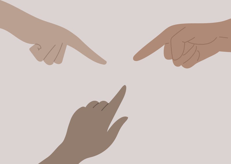 People pointing at one another.