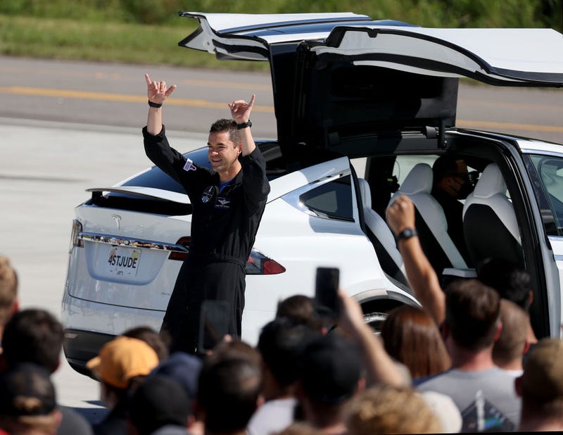 Inspiration4 crew member Jared Isaacman waves to the crowd as he and Sian Proctor, Hayley Arceneaux and Chris Sembroski prepare to leave for their flight on the SpaceX Falcon 9 rocket and Crew Dragon at launch Pad 39A at NASA’s Kennedy Space Center on September 15, 2021 in Cape Canaveral, Florida.