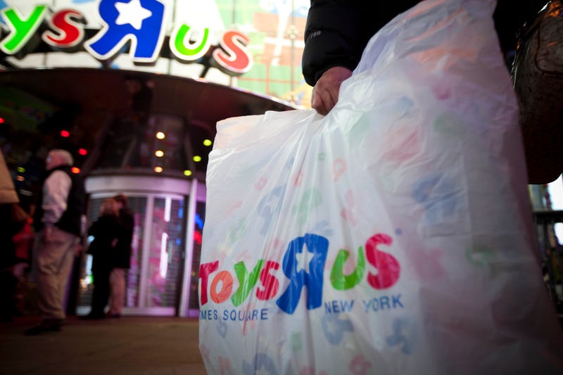 Shopper with bag at Toys R Us on Black Friday