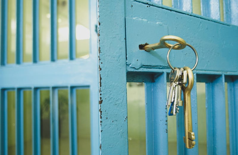 Keys in the lock of a cell door in jail.