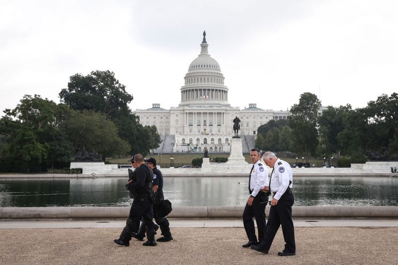 Members of the U.S. Capitol Police, including chief Tom Manger (R), walk the grounds near the 'Justice for J6' rally with supporters of those charged in the January 6 attack on the U.S. Capitol September 18, 2021 in Washington, DC. The protestors gathered in Washington, DC on Saturday to support over 600 people arrested and charged in connection with the January 6 attempted insurrection at the U.S. Capitol. (Photo by Tasos Katopodis/Getty Images)