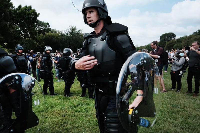 Police in riot gear stand in front of the U.S. Capitol during the 'Justice for J6’ rally in support of those charged in the January 6 attack on the U.S. Capitol on September 18, 2021 in Washington, DC. Protestors to gathered in Washington, DC on Saturday to support over 600 people arrested and charged in connection with the January 6 attempted insurrection at the U.S. Capitol. (Photo by Spencer Platt/Getty Images)