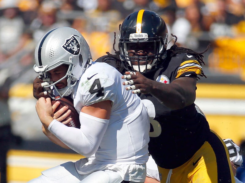 Melvin Ingram III #8 of the Pittsburgh Steelers sacks quarterback Derek Carr