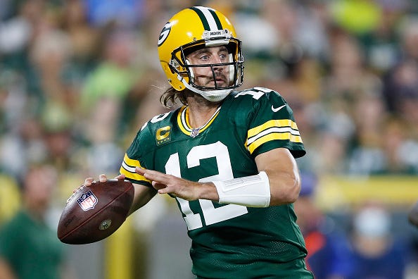 Aaron Rodgers models the Packers green uniform tops. 