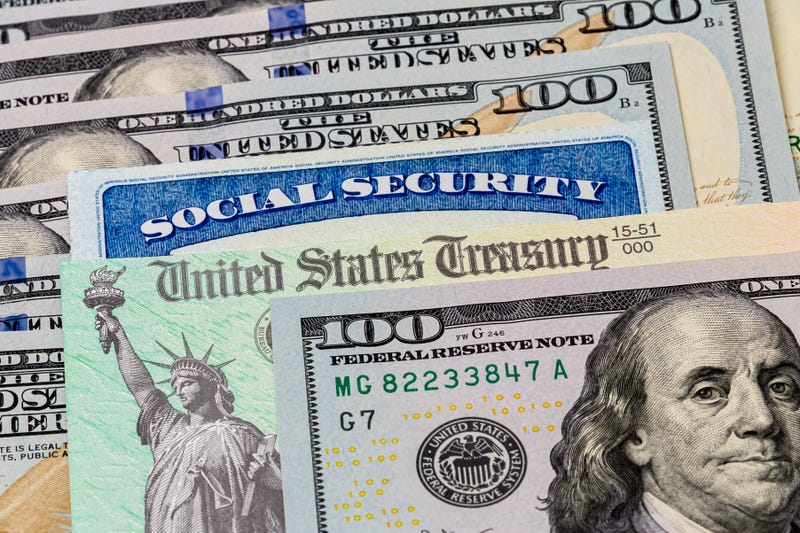 Social security card and hundred dollar bills. 