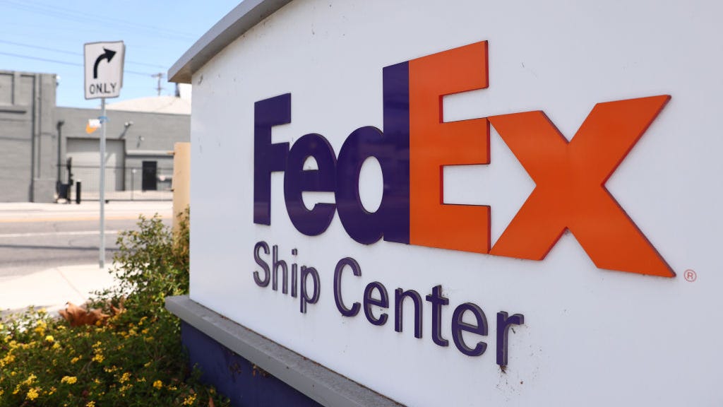 FedEx to close store, freeze hiring as demand slumps