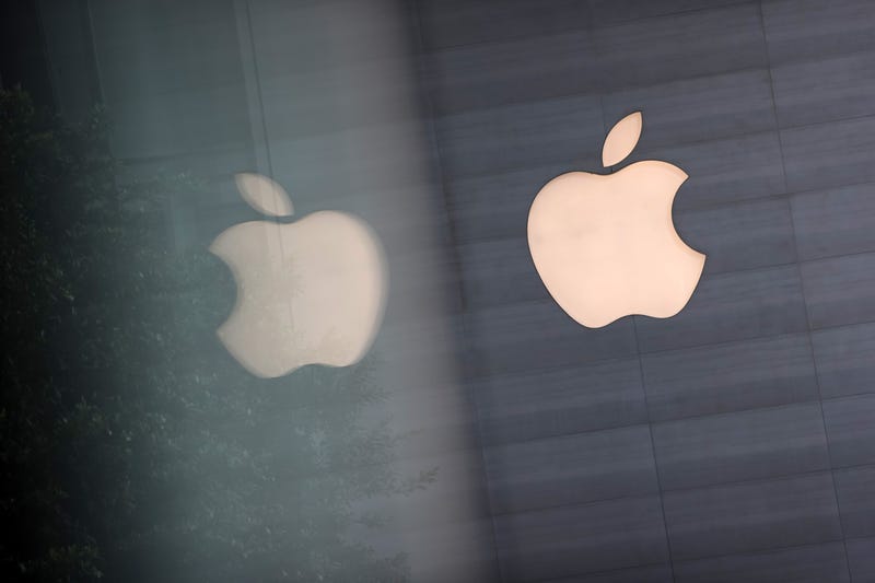 SINGAPORE, SINGAPORE - SEPTEMBER 24: An Apple logo is reflected on glass at the Apple Store at Orchard Road on September 24, 2021 in Singapore. Apple announced September 14 the release of four variants of its latest iPhone 13, alongside other upgrades to its product lineup.