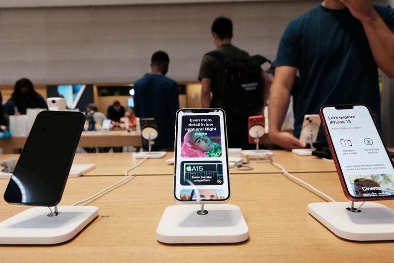 People shop at the Fifth Avenue Apple Store during the launch of Apple’s new iPhone 13 and iPhone 13 Mini on September 24, 2021 in New York City. The new phones come equipped with a A15 Bionic chip, improved dual-camera system and longer battery life than the iPhone 12. The iPhone 13 Mini starts at $729, and the iPhone 13 starts at $829. (Photo by Spencer Platt/Getty Images)