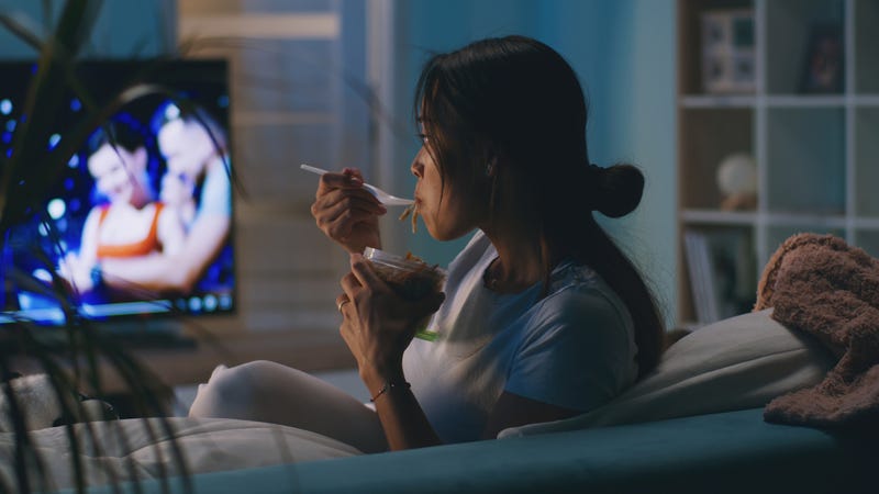 Asian woman watching TV. 