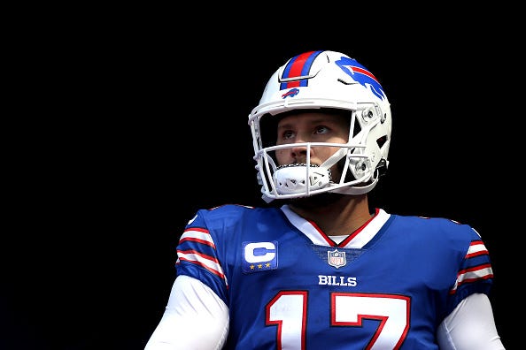 Josh Allen models the Bills blue uniform tops. 