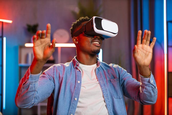 Man playing with VR headset at home