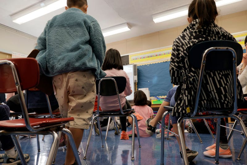 Masked students participate in a lesson in their classroom at Yung Wing School P.S. 124 on September 27, 2021 in New York City.