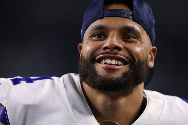  Dak Prescott #4 of the Dallas Cowboys celebrates a 41-21 over the Philadelphia Eagles at AT&T Stadium on September 27, 2021 in Arlington, Texas.