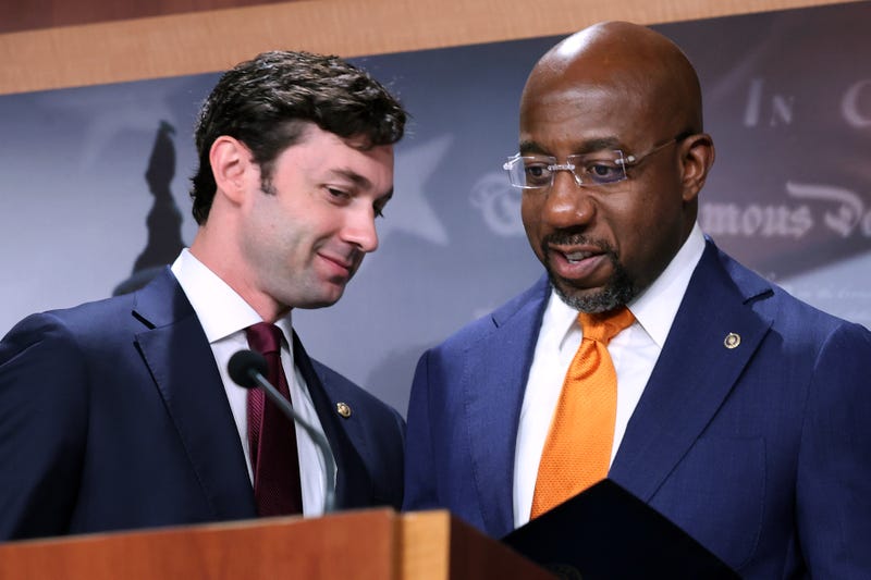 Sen. Jon Ossoff (D-GA) (L) and Sen. Raphael Warnock (D-GA) hold a news conference with fellow Democratic members of Congress to push for a solar tax credit at the U.S. Capitol on September 28, 2021 in Washington, D.C.