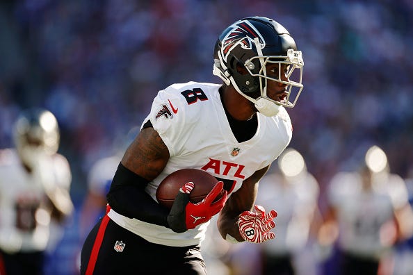 Kyle Pitts models the Falcons' white uniform tops. 