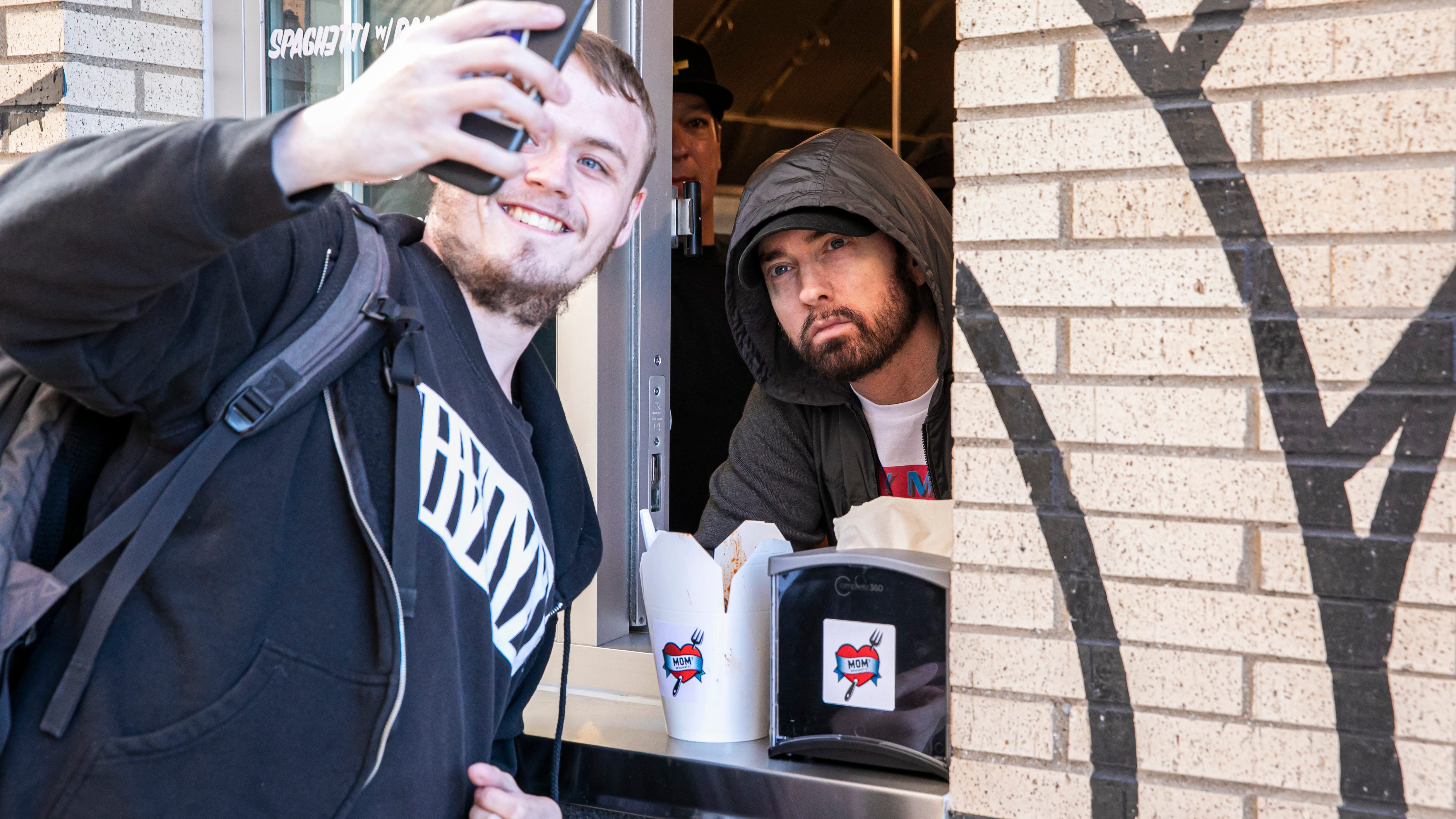 PHOTOS: Eminem take orders, serves spaghetti at his new Detroit restaurant