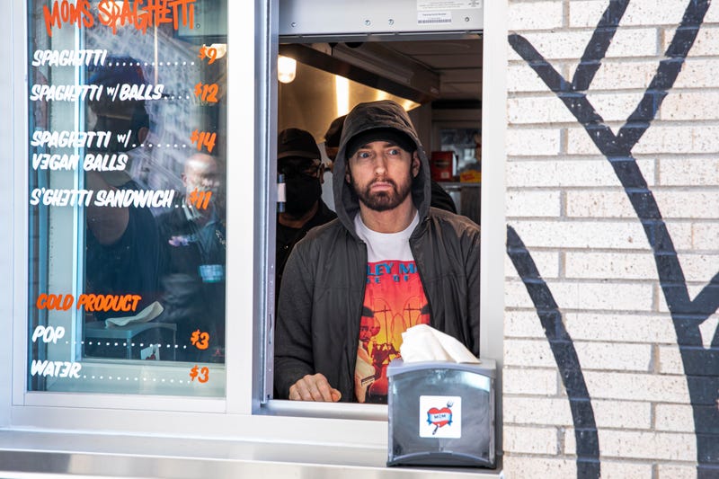 Eminem serves Mom's Spaghetti on the opening night of his restaurant Mom's Spaghetti on September 29, 2021 in Detroit, Michigan.