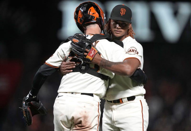 Camilo Doval #75 and Buster Posey #28 of the San Francisco Giants celebrate after defeating the Arizona Diamondbacks 1-0 at Oracle Park on September 29, 2021 in San Francisco, California.