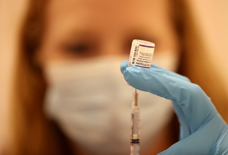 Safeway pharmacist Ashley McGee fills a syringe with the Pfizer COVID-19 booster vaccination at a vaccination booster shot clinic on October 01, 2021 in San Rafael, California.