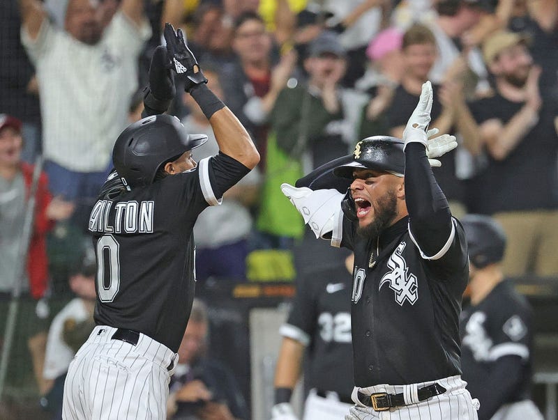 Yoan Moncada #10 of the Chicago White Sox (R) celebrates his two run home run in the 8th inning with pinch runner Billy Hamilton #0 against the Detroit Tigers at Guaranteed Rate Field on October 02, 2021 in Chicago, Illinois. The White Sox defeated the Tigers 5-4.
