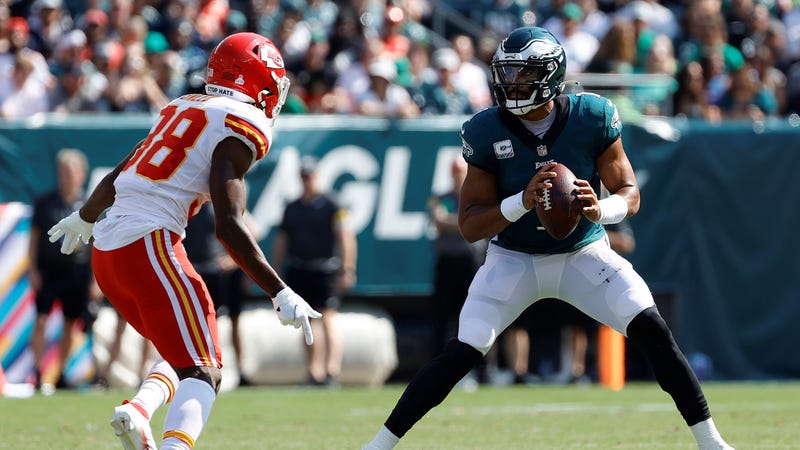Jalen Hurts of the Philadelphia Eagles is pressured by L'Jarius Sneed of the Kansas City Chiefs at Lincoln Financial Field on October 3, 2021 in Philadelphia, Pennsylvania.