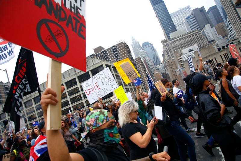 People march as they protest against NYC's coronavirus (COVID-19) vaccine mandate that went into effect today for public school employees on October 04, 2021 in New York City
