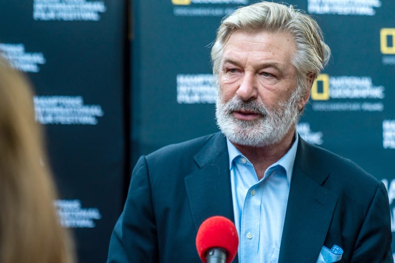 alec baldwin in front of national geographic backdrop