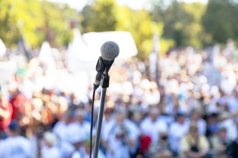 microphone in front of blurry crowd
