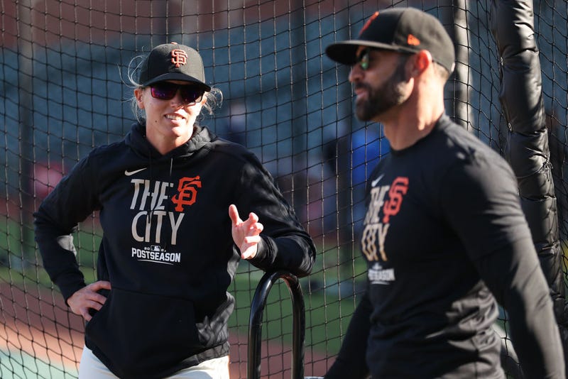 Coach Alyssa Nakken #92 of the San Francisco Giants talks with manager Gabe Kapler #19 prior to Game 1 of the National League Division Series against the Los Angeles Dodgers at Oracle Park on October 08, 2021 in San Francisco, California.