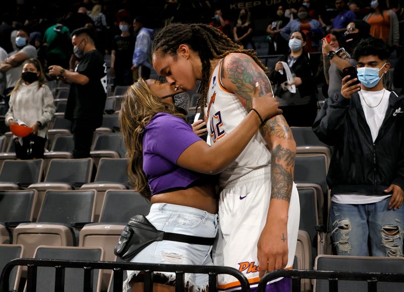 Brittney Griner #42 of the Phoenix Mercury kisses her wife Cherelle Griner in the stands after the Mercury defeated the Las Vegas Aces 87-84 in Game Five of the 2021 WNBA Playoffs semifinals to win the series at Michelob ULTRA Arena on October 8, 2021 in Las Vegas, Nevada. 