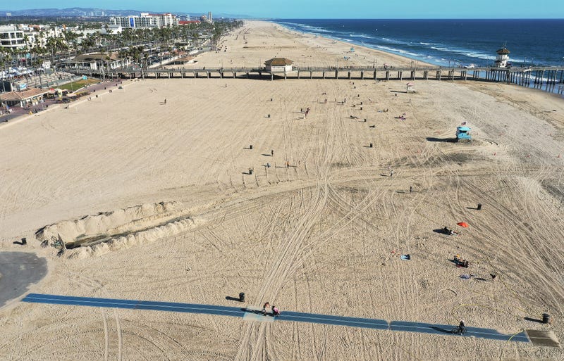  In an aerial view, few people gather along the beach about one week after an oil spill from an offshore oil platform on October 9, 2021 in Huntington Beach, California. 