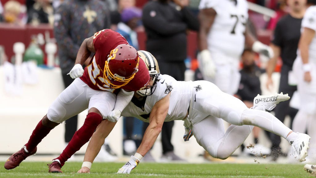 Taysom Hill carted off after brutal, head-to-head hit against Washington; see the play