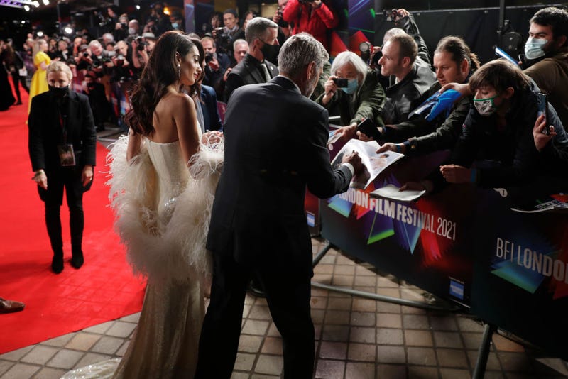 George Clooney Signing An Autograph