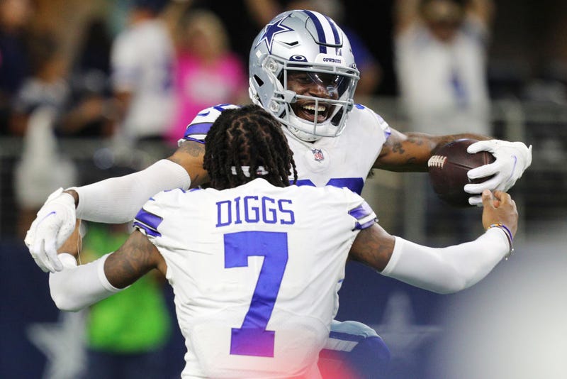 Anthony Brown #30 of the Dallas Cowboys celebrates a touchdown return with Trevon Diggs #7 after a turnover by the New York Giants during the fourth quarter at AT&T Stadium on October 10, 2021 in Arlington, Texas.