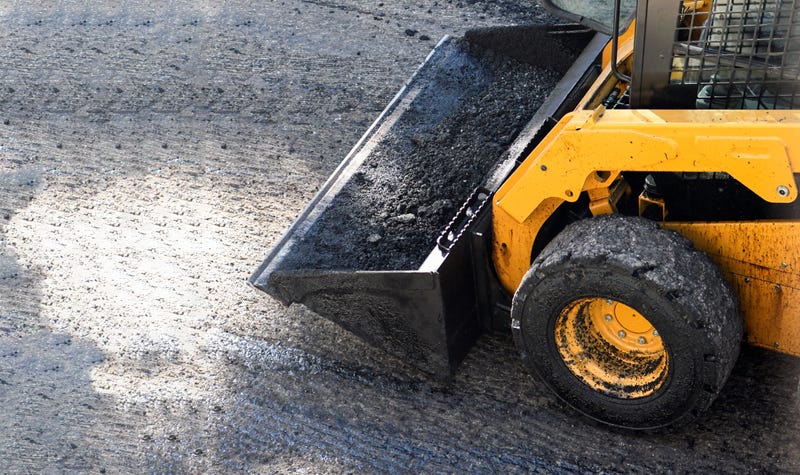At least one person was taken into custody after police say two suspects tag-teamed to steal heavy duty machinery and led authorities on a chase before wrecking Downriver.