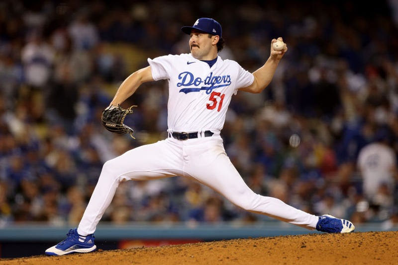 Alex Vesia #51 of the Los Angeles Dodgers pitches against the San Francisco Giants during the seventh inning.