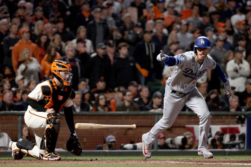  Cody Bellinger #35 of the Los Angeles Dodgers celebrates his RBI single to score Justin Turner #10 against the San Francisco Giants during the ninth inning in game 5 of the National League Division Series at Oracle Park on October 14, 2021 in San Francisco, California.