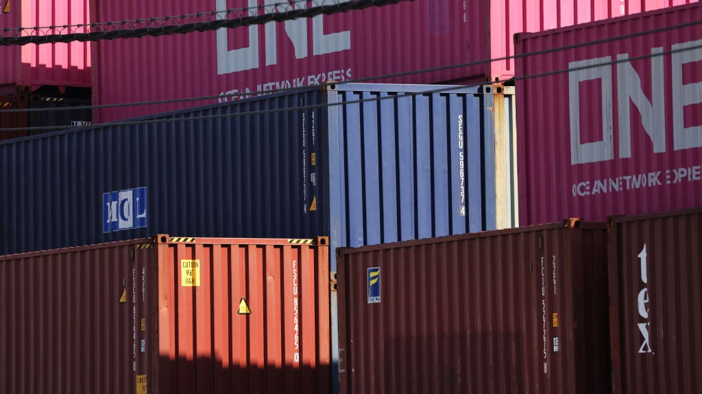 Shipping container from L.A. port falls off truck, crushes car