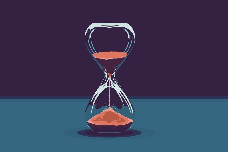 Hourglass with red sand. 