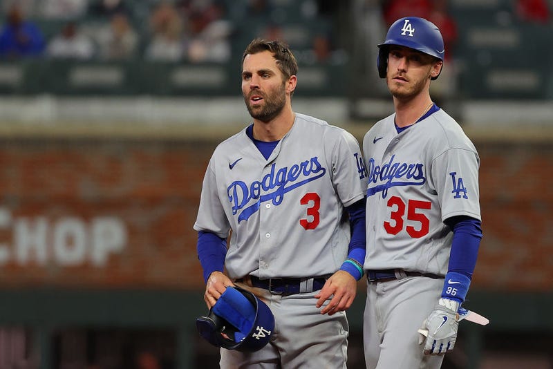 Chris Taylor #3 and Cody Bellinger #35 of the Los Angeles Dodgers react against the Atlanta Braves during the ninth inning of Game One of the National League Championship Series.