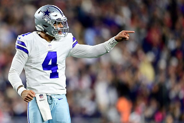 Dak Prescott models the Cowboys white uniform tops. 
