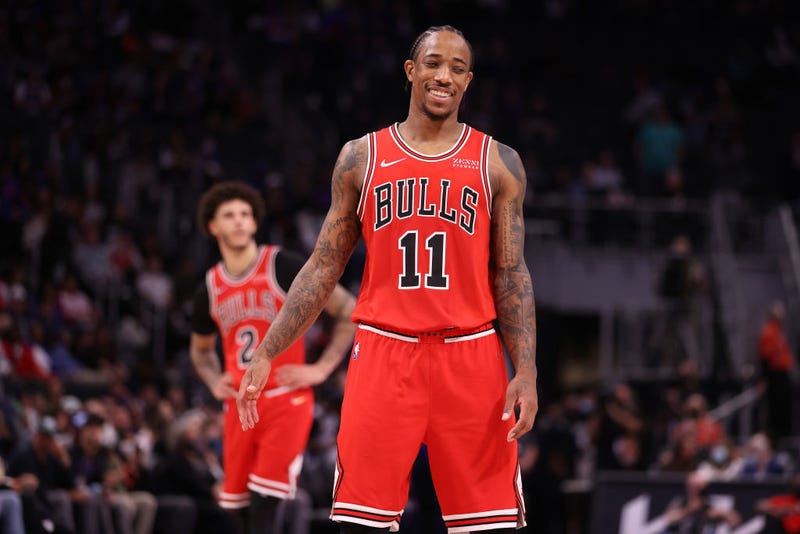 DeMar DeRozan #11 of the Chicago Bulls smiles in front of Lonzo Ball #2 while playing the Detroit Pistons during the second half at Little Caesars Arena on October 20, 2021 in Detroit, Michigan. Chicago won the game 94-88. 