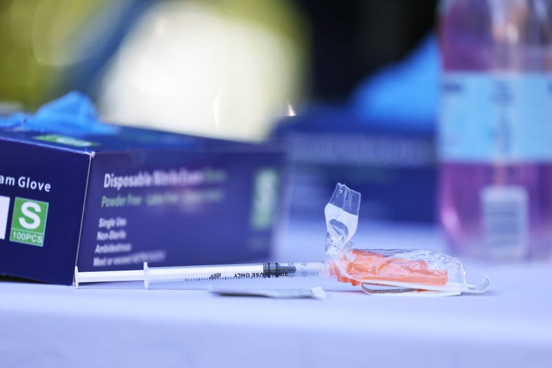 A syringe prepared with the Pfizer-BioNTech coronavirus (COVID-19) vaccine sits on a table at a #VAXTOSCHOOL pop-up site at Life of Hope Center on October 21, 2021 in New York City.